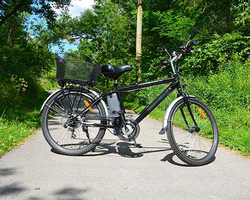 a black electric bike on a path